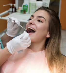 Woman getting teeth cleaning