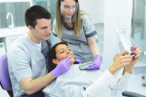 Dentist placing veneers